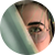 Close-up of person wearing glasses